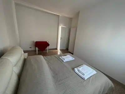 Letto o letti in una camera di Casa Roma rooms& apartmens