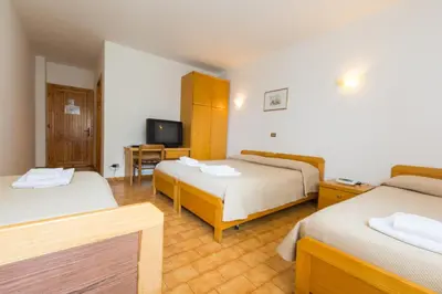 Letto o letti in una camera di Albergo Dalla Mena