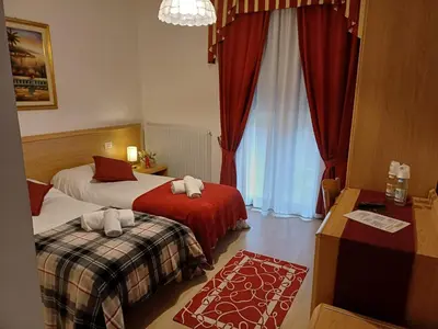 Letto o letti in una camera di Albergo Dalla Mena