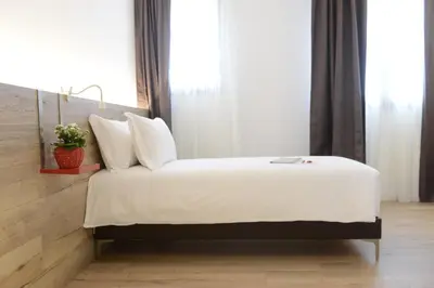Letto o letti in una camera di L'Insolito Posto