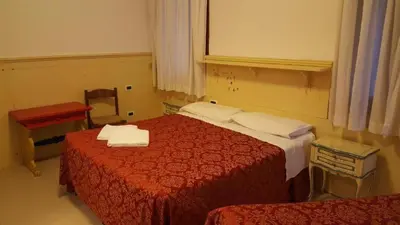 Letto o letti in una camera di Alloggi Gerotto Calderan 3