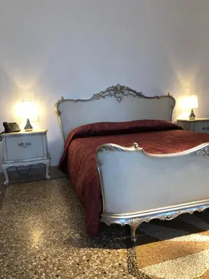 Letto o letti in una camera di Hotel Donna Lucia