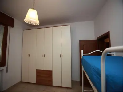 Letto o letti in una camera di Spacious flat 50mt from the beach