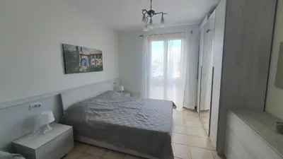 Letto o letti in una camera di Family Garden Apartment – Borgo dei Fiori