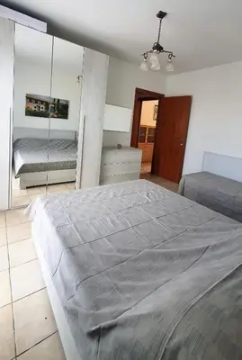 Letto o letti in una camera di Family Garden Apartment – Borgo dei Fiori