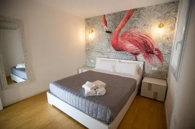 Letto o letti in una camera di L'Alba dei Pescherecci VISTA CANALE