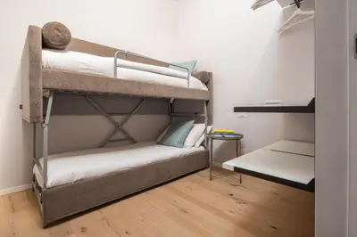 Letto o letti in una camera di Fondamenta de la Sensa Garden Loft R&R