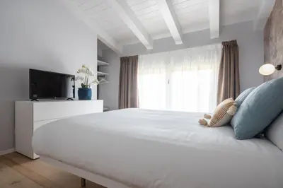 Letto o letti in una camera di Fondamenta de la Sensa Garden Loft R&R
