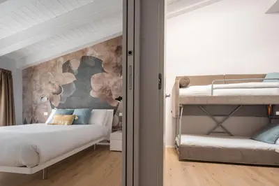 Letto o letti in una camera di Fondamenta de la Sensa Garden Loft R&R