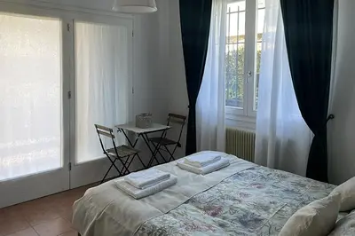 Letto o letti in una camera di Via Ellero 12