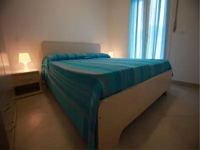 Letto o letti in una camera di Charming flat for up to 6 guests near the beach