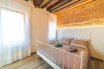 Letto o letti in una camera di Casetta Stretta Bersaglio