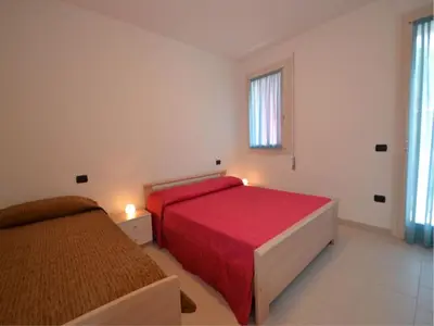 Letto o letti in una camera di Apartment in the heart of Rosolina Mare
