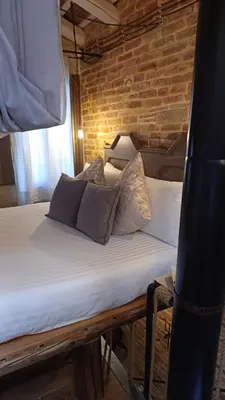 Letto o letti in una camera di Dimora 421 ApartSuite Chioggia