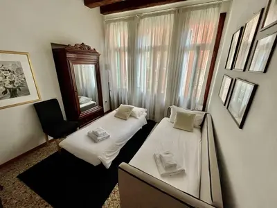 Letto o letti in una camera di PALAZZO SAN SAMUELE - elegant apartment in San Marco