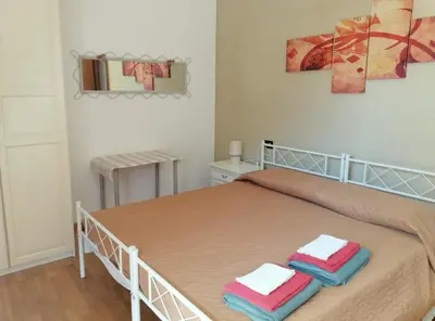 Letto o letti in una camera di Bilocale NICOL 4 posti Padova ovest